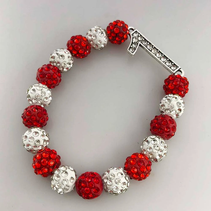 Delta Sigma Theta rhinestone bracelet with red and white beads, featuring a number charm.