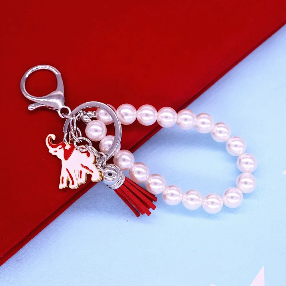 Delta Sigma Theta chain accessory with elephant and pearl charms for sorority paraphernalia. Ideal for black greek lettered organization.