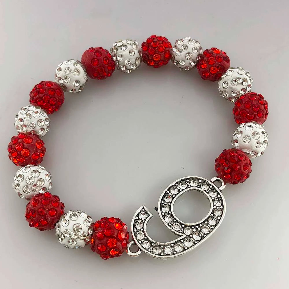 Delta Sigma Theta rhinestone bracelet with crimson and cream beads, featuring the number 9. Perfect sorority paraphernalia and accessories.