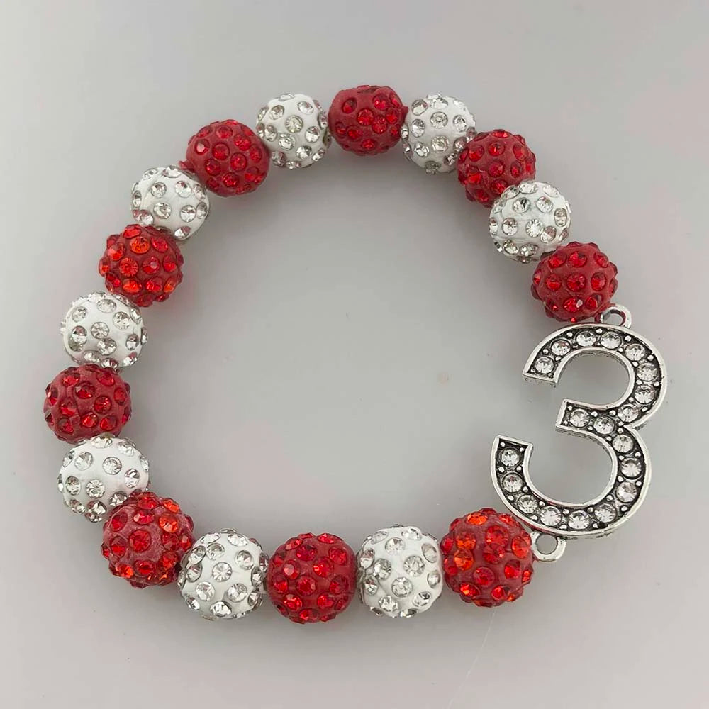 Delta Sigma Theta rhinestone bracelet with crimson and cream beads and a number three charm, perfect sorority paraphernalia.