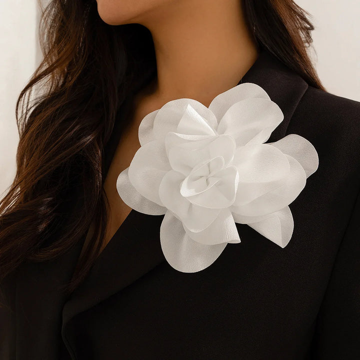 Woman wearing a classic sorority flower brooch, perfect sorority paraphernalia for black sororities and greek lettered organizations.