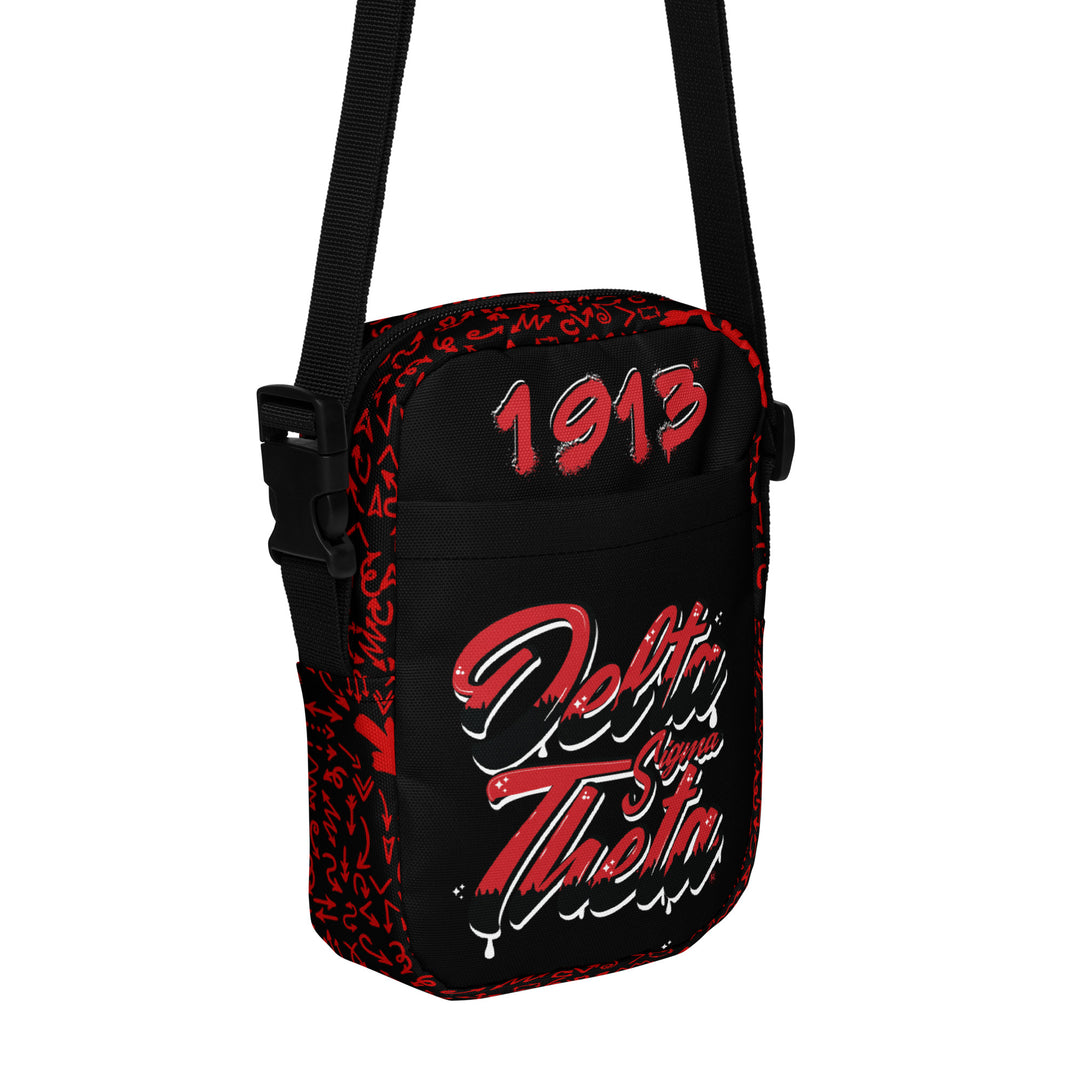 Delta Sigma Theta graffiti utility crossbody bag, stylish sorority paraphernalia for everyday use and events.