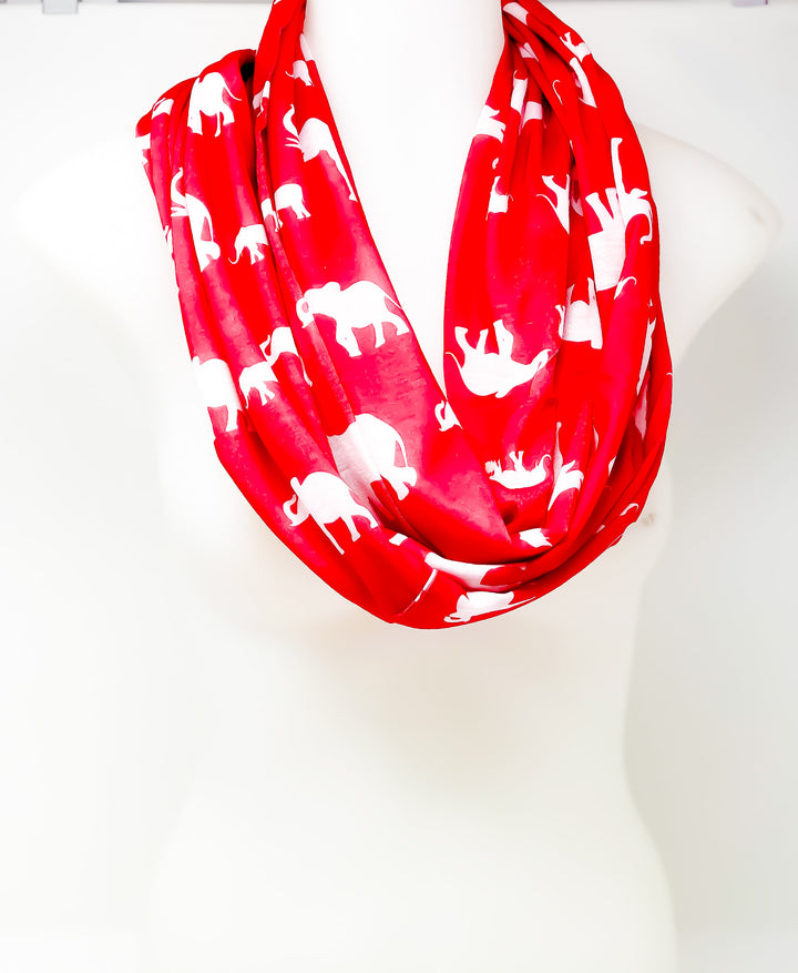 Bright red infinity scarf with white elephant prints, perfect for stylish comfort and sorority or fraternity gear.