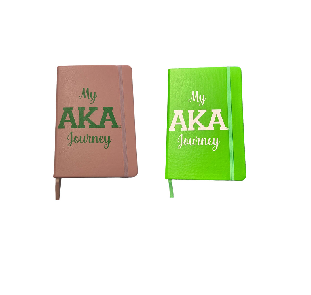 Brown and green bound journals titled "My AKA Journey," perfect for sorority and fraternity paraphernalia and Greek gear.