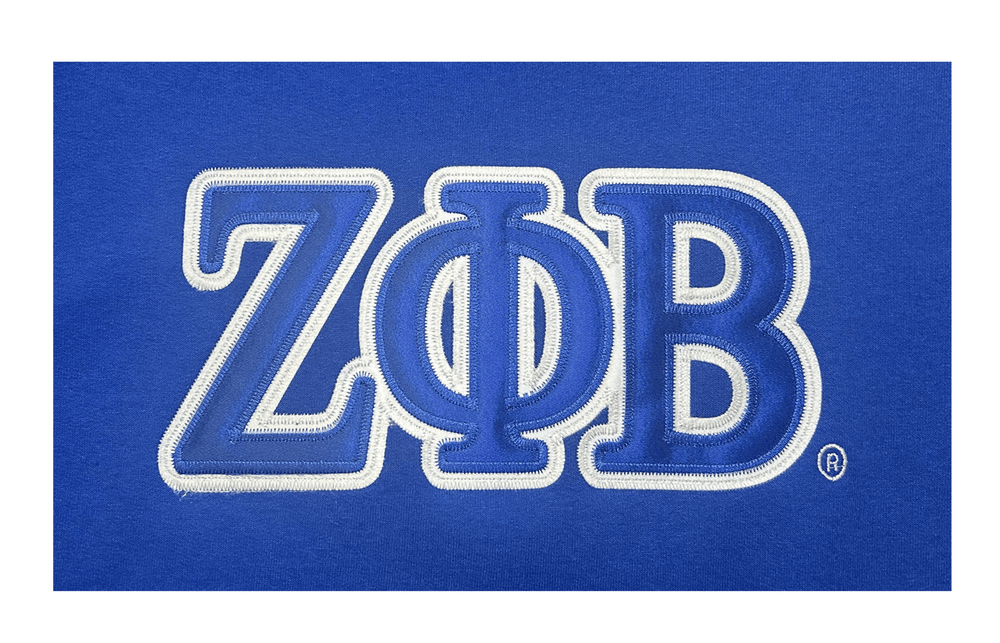 Zeta Phi Beta embroidered patch on blue sweatshirt, perfect for sorority and fraternity Greek gear paraphernalia.