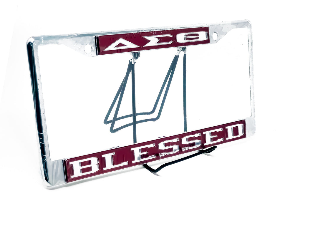 Delta Sigma Theta car tag frame featuring 'BLESSED' in bold lettering, perfect for showcasing sorority pride.