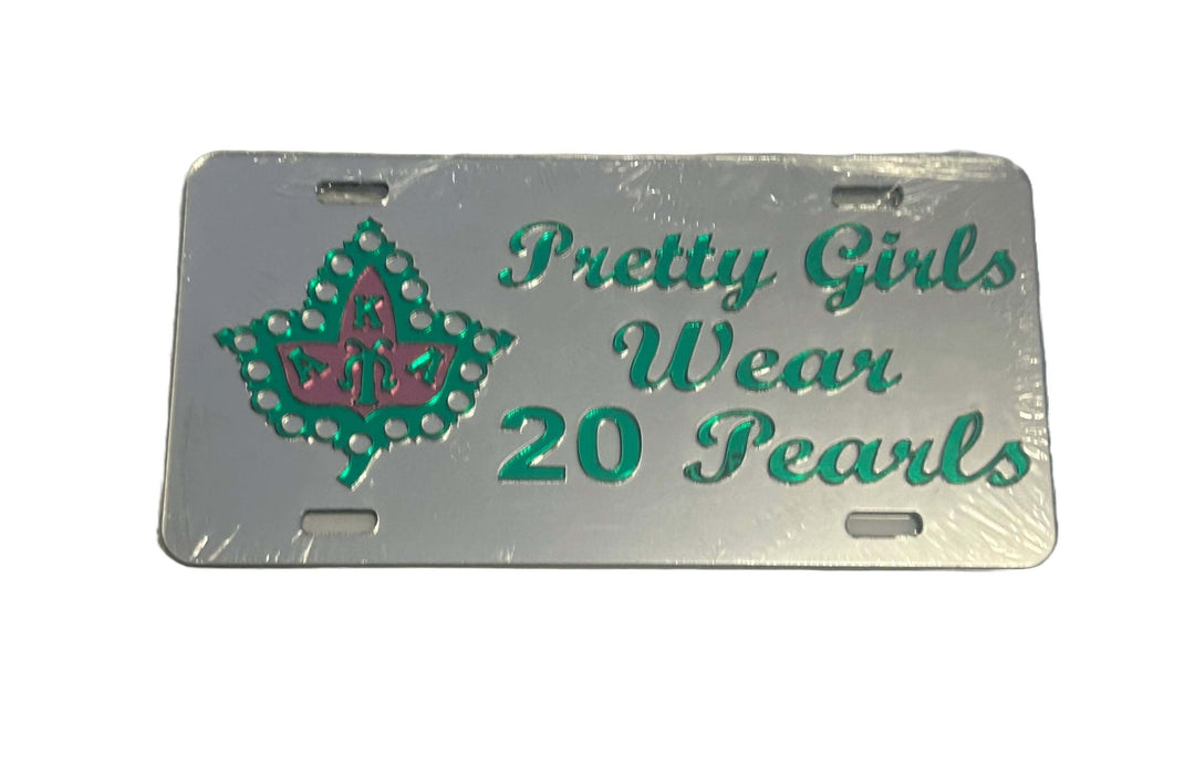 AKA car tag featuring "Pretty Girls Wear 20 Pearls" design, showcasing sorority pride and Greek gear elegance.