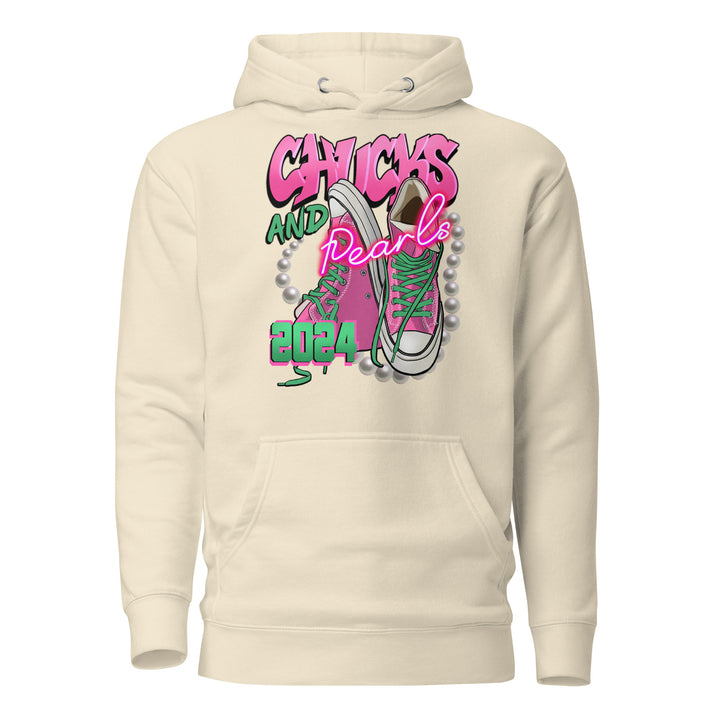 Trendsetting "Chucks and Pearls" hoodie featuring graphic design in pink and green - perfect for sorority apparel and election season.