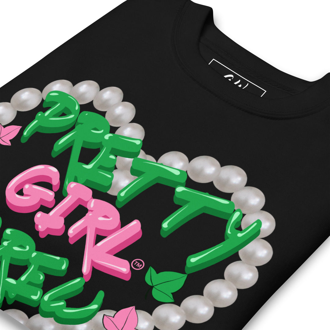 Pretty Girl Crew sweatshirt with pink and green text, surrounded by a pearl design, representing sorority paraphernalia and black sorority apparel.