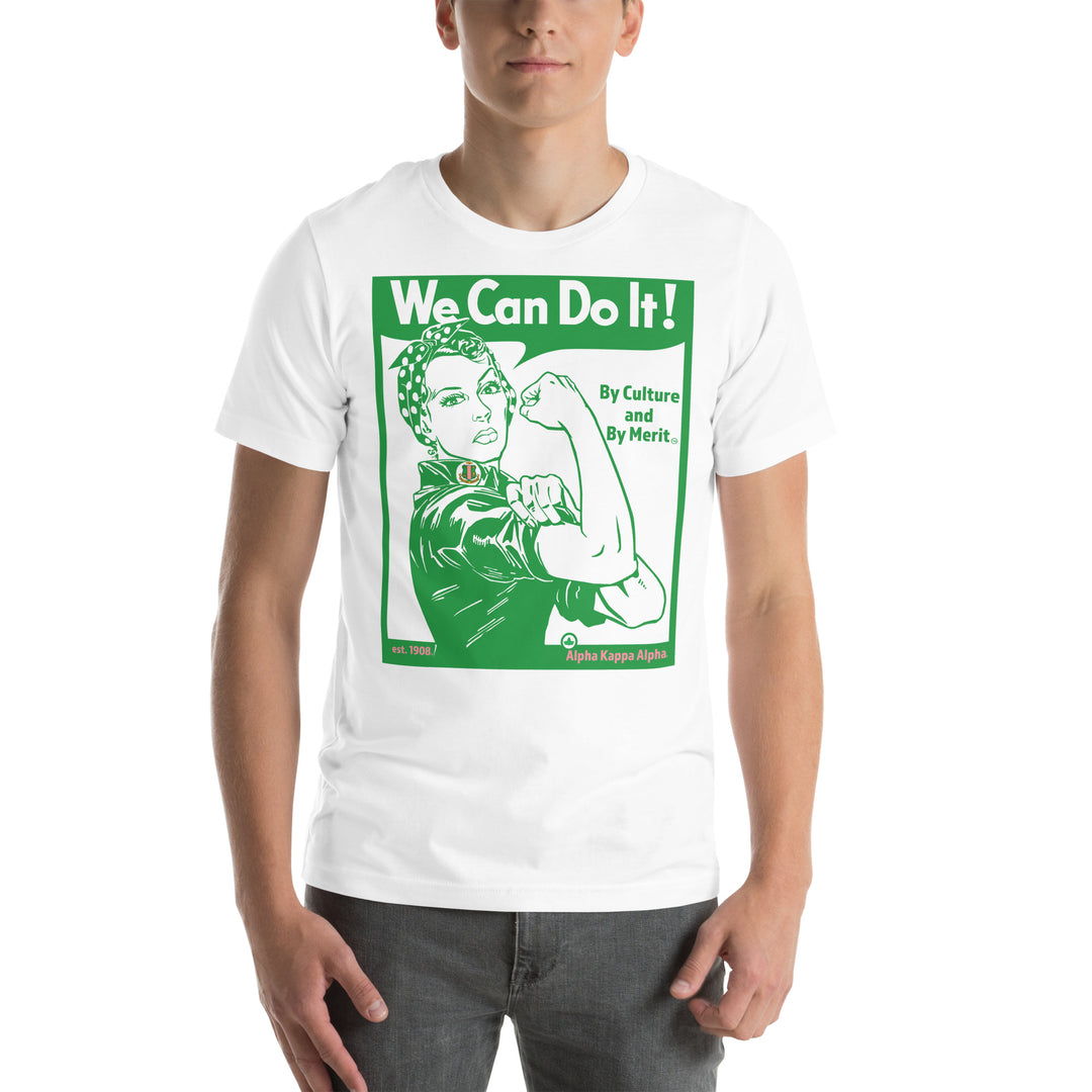 Man wearing AKA Black Rosie T-Shirt inspired by Rosie the Riveter with text "We Can Do It! By Culture and By Merit." in green and white design.